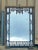 This is a Chinese Chippendale style mirror with ornate carved fretwork and pagoda. The top has faux marble molding, and...