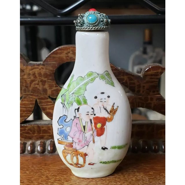 This is a Mid 20th Century Chinese Famille Rose Porcelain Many Sons Motif Snuff Bottle. It measures 3 1/8" tall, 1 1/2"...