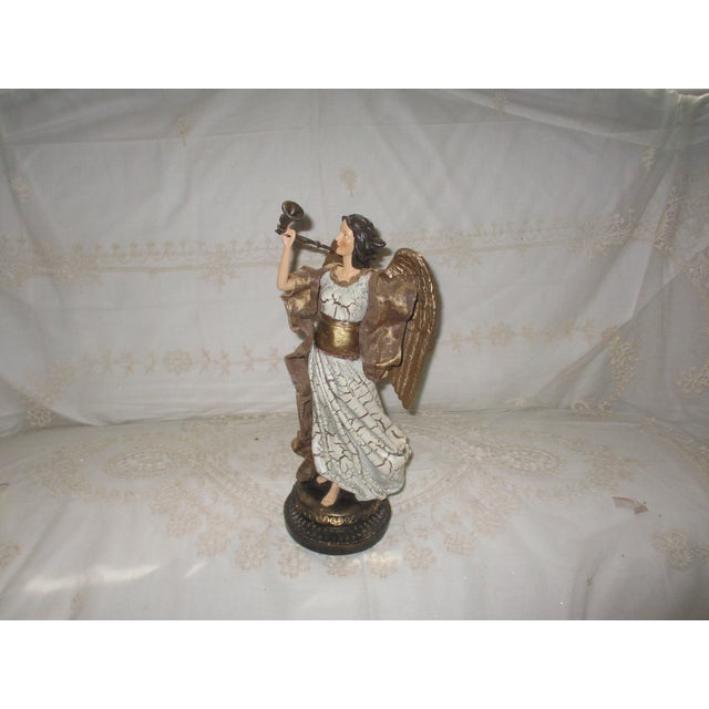 This is a Gorgeous! Vintage Angel Blowing Horn with Ornate Golden Wings with a Antiqued White Dress on a Ornate Base with...
