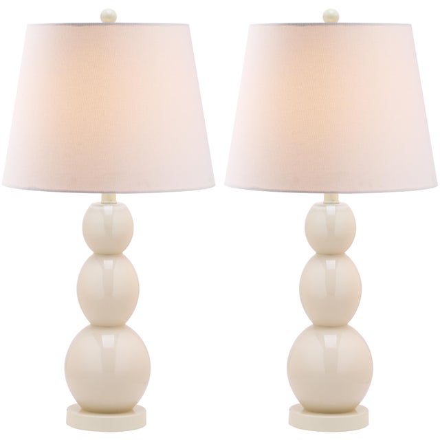 A perfect balance of form and function, this graceful lamp features three shiny light gray glass balls that graduate in...