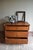 of a 19th-century German oak chest of drawers. The height is 90 cm. The width is 117 cm. The depth is 58 cm. with three...