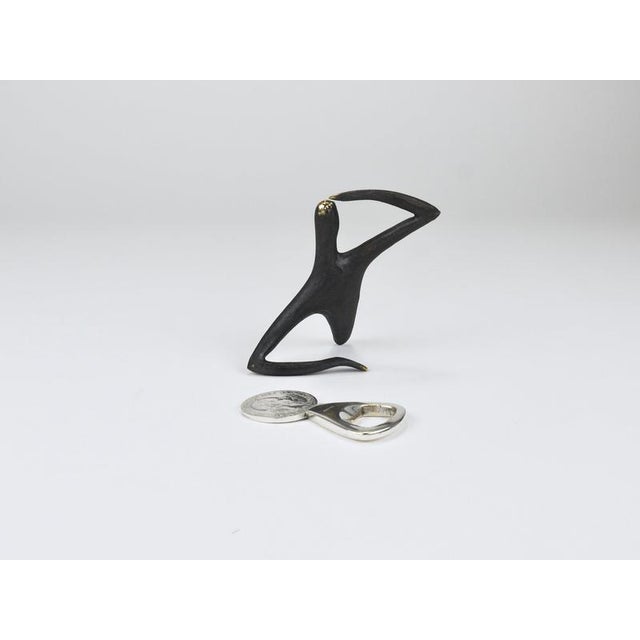 A beautiful bottle opener made of solid silver-plated brass, designed and executed by carl auböck ii in the 1950s. The...