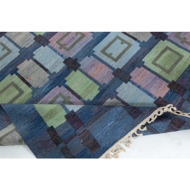 The Vintage Swedish Flat-Weave Rug known as "Spise Hall," designed by the esteemed Judith Johansson, is a remarkable...