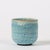 A small 1970s studio pottery teacup in a blue-and-white mottled volcano glaze. Particularly large craters on interior...
