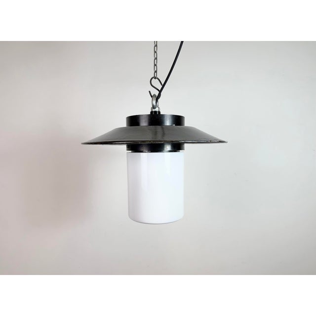 Vintage Industrial lamp made by Elektrosvit in former Czechoslovakia during the 1960s. It features a bakelite top, a gray...