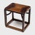 The streamlined form of this low Chinese side table draws from the austere designs of Ming-dynasty furniture. Lightweight...