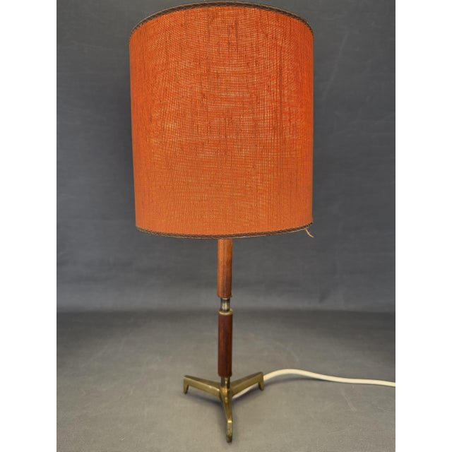 Table lamp, attributed to J.T. Kalmar, Austria, vintage, tripod. teak wood and brass body, 1960s, unsigned. Measures 33 cm...