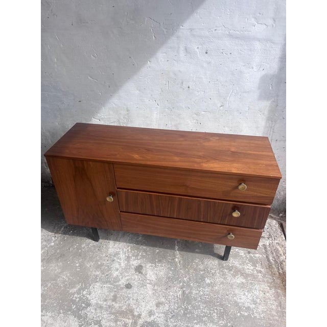 Elegant mid-century chest of drawers manufactured in the former East Germany during the 1960s. Its compact proportions...