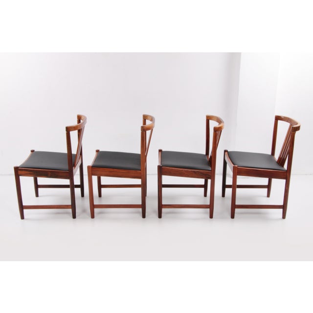 Dinner chairs design by Illum Wikkelsø 1960 skai seats are of a beautiful new quality. This piece has an attribution mark,...