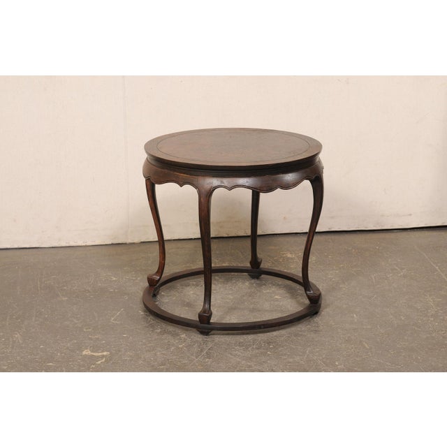 A vintage wooden accent table, with scalloped skirt, from American furniture makers, "Baker Furniture." This American made...