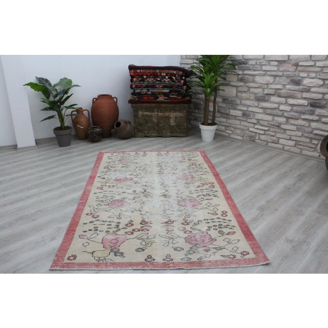 This gorgeous hand knotted Vintage Anatolian area rug is approximately 60 years old in excellent vintage condition. The...
