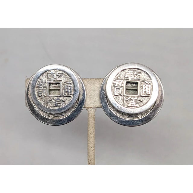 1950s Vintage Signed Napier Doris Day Rhodium Plated Two Stacked Asian Coins Clip Earrings-2 Pieces For Sale - Image 5 of 9