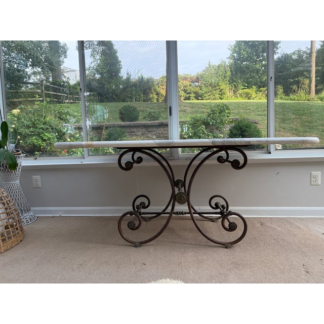 ⸻ Elegant 19th C French baker’s table featuring a solid marble top with beautiful natural veining. The iron base has an...
