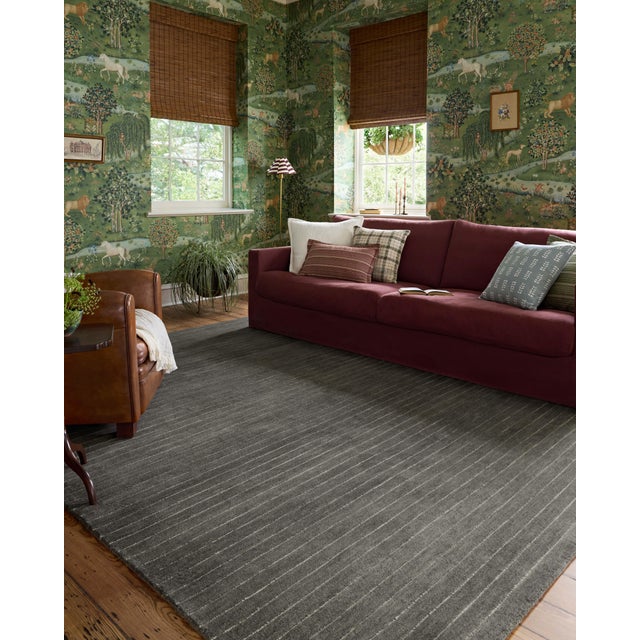 The Henry Collection from Chris Loves Julia x Loloi is a hand-tufted area rug that adds a touch of personality to a solid-...
