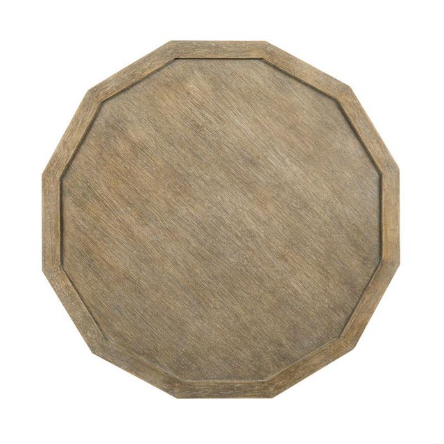 A stylized French form with a multi-faceted top resting over two shelves, elevated on squared legs that terminate to...