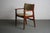 This is a stunning Danish 1970's teak Captain's dining chair attributed to Johannes Andersen. Overall the teak wood is in...