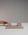 This early 20th century writing desk from France is finished in antique white, worked in marble. Its form follows honest,...