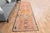 Vintage Hand-Knotted runner rug is a semi-antique vintage area rug. The '70s Eastern region of Anatolia's unique rug is...