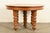 An outstanding antique Victorian or American Empire carved oak extension dining table In the manner of R.J. Horner & Co....