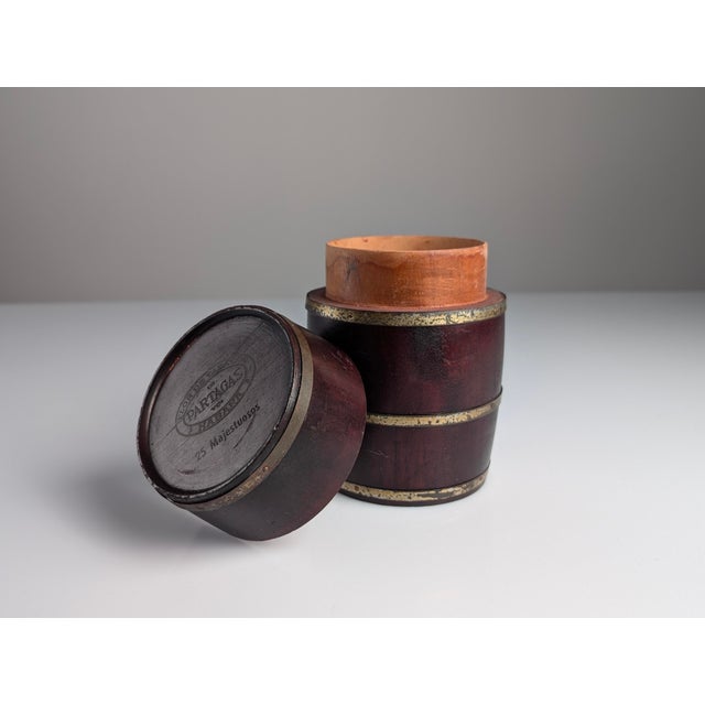 This cylindrical cigar humidor barrel was produced in Havana, Cuba, for the tobacco manufacturer Flor de Tabacos de...