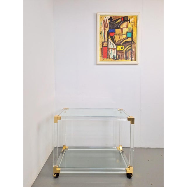 Painting: An abstract composition in a white frame, signed W.B. and dated 1993 in the lower right corner. The painting is...