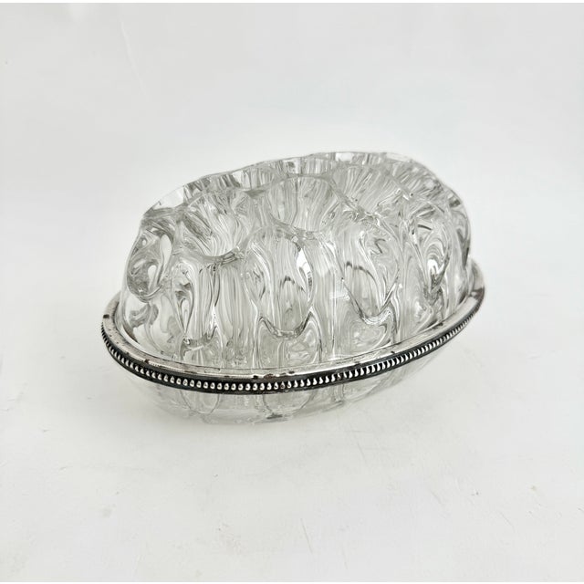 This elegant vintage English flower frog features a heavy beautifully textured blown glass dome flower block made by the...