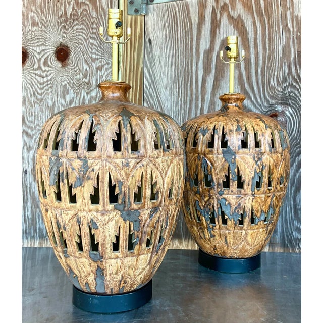 A fabulous pair of vintage Costal table lamps. A punch cut palm frond design with a matte glazed finish. Fully restored...
