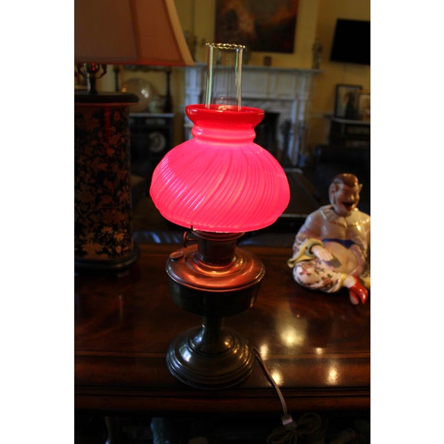 Vintage Aladdin Model 12 Electrified Oil Lamp with Swirled Glass Red Shade, made by the Mantle Lamp Company of Chicago. I...