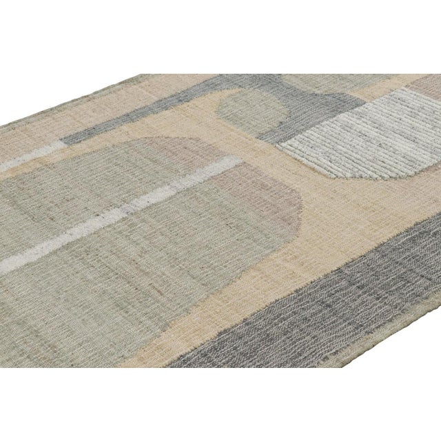 Made with handwoven wool and jute, this 5x7 contemporary flatweave rug by Rug & Kilim enjoys geometric patterns in beige-...
