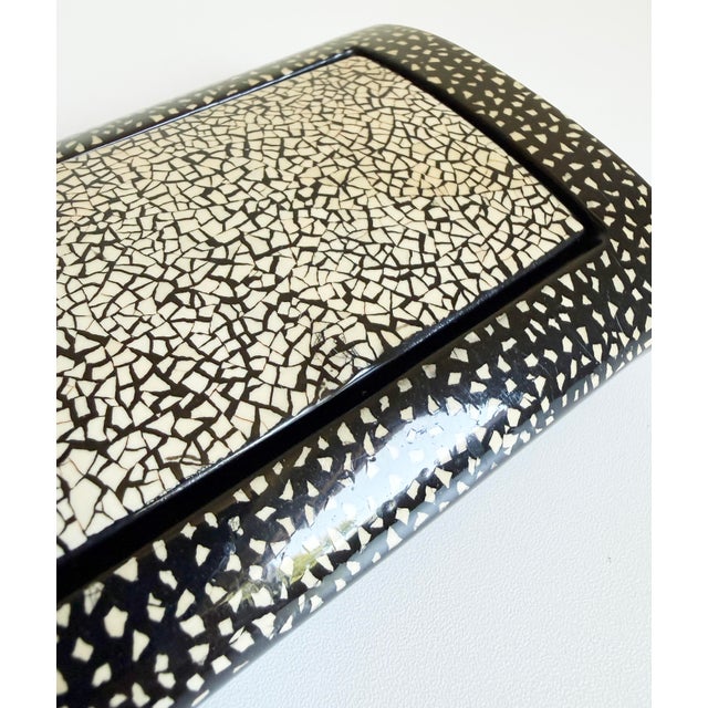 Contemporary, circa late 20th century eggshell and lacquer lidded box done in an Art Deco style reminiscent of work...
