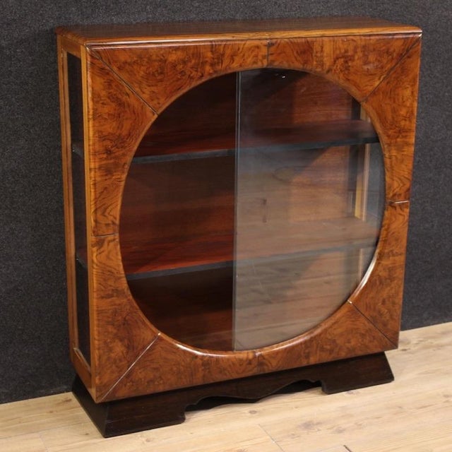 Italian display cabinet from the first half of the 20th century. Furniture with a shape and style typical of the 1930s and...