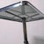 This is an iconic height-adjustable coffee table from the 1970s designed by Allegri Parma, featuring a chromed steel frame...