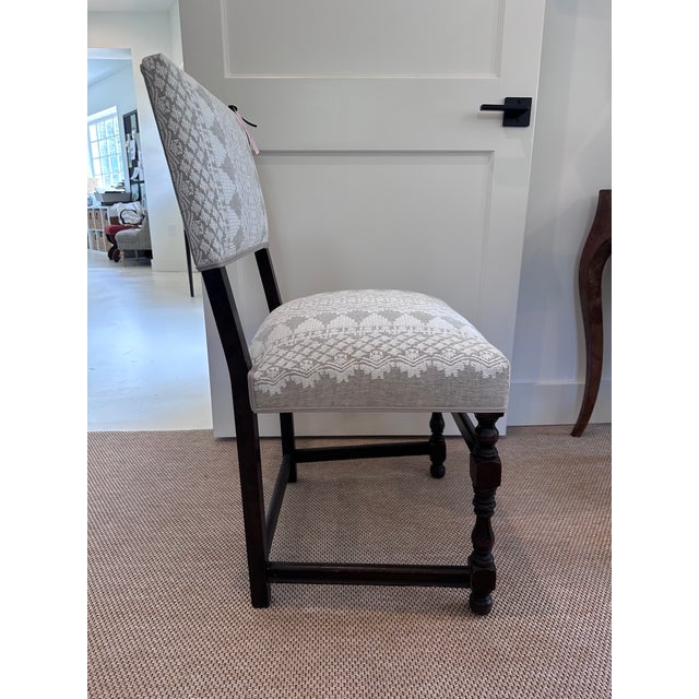 This dark walnut chair is absolutely antique, although I do not know its origins. It's handsome proportions and strong...