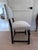 This dark walnut chair is absolutely antique, although I do not know its origins. It's handsome proportions and strong...