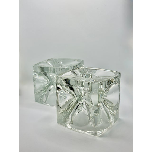 Elevate your home's ambiance with this stunning pair of Mid-Century Modern clear art glass cube votive candle holders,...