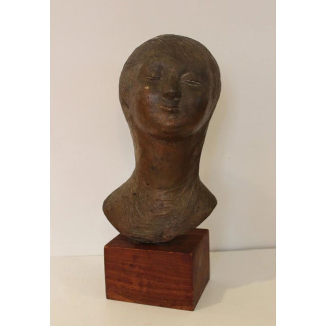 Stunning 1950s large bronze sculpture by Italian artist Pino Conte tittle "Head Of A Girl" in wood base, signed by the...