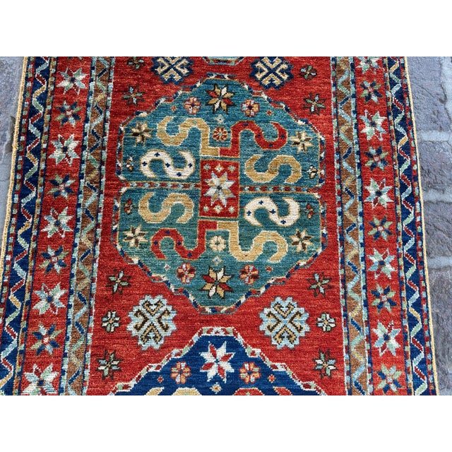 This beautiful traditional hand-knotted Afghan Turkmen Zanjiri Design Oushak rug will make your home look even better. It...
