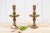 This antique Indian hand-etched brass candle holder is a striking, tall piece characterized by its traditional design. It...