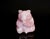 A charming hand-carved figure of a seated bear, sculpted from natural rose quartz of soft, translucent blush tone. With...