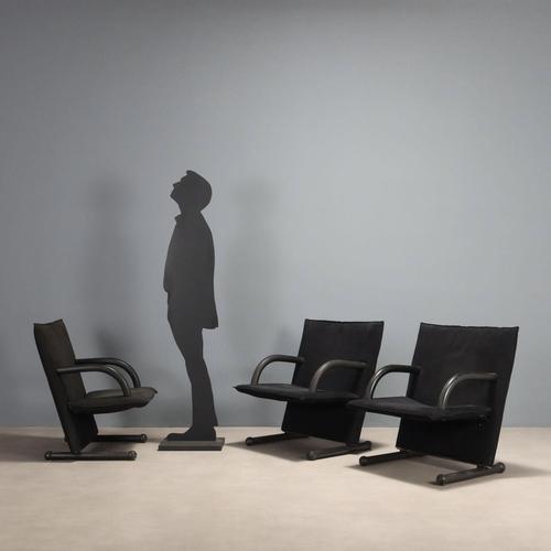 Set of three post-modern suede armchairs with a metal frame, rubber-covered armrests and legs with foam padding. This...