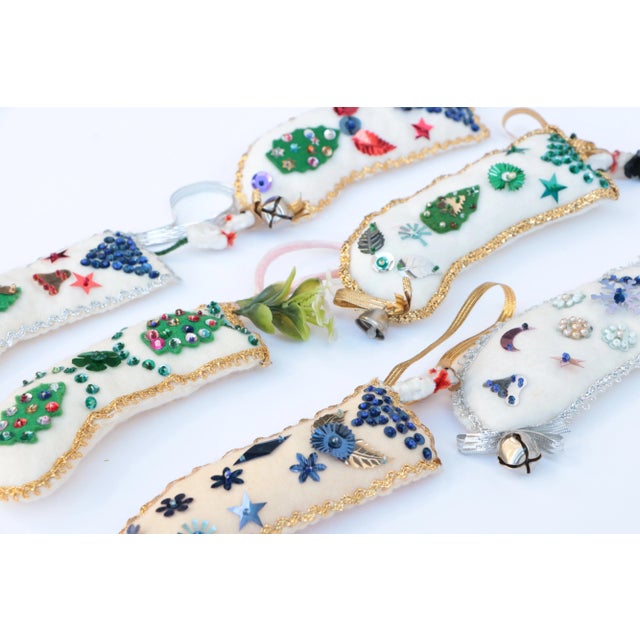 This set of felt Christmas stocking ornaments is ready to decorate your tree this holiday season. Handmade in the early...