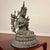 A beautifully detailed vintage bronze statue of Tara from Nepal, seated in the lotus position atop a double-lotus...