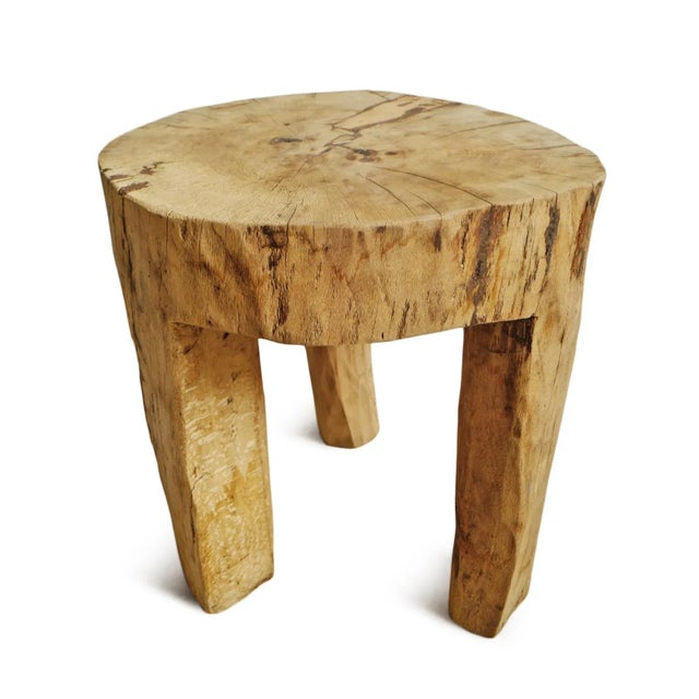 Rustic and beautiful hand ax chiseled raw wood table created from a solid hard wood trunk. Naga tribal indigenous accent...