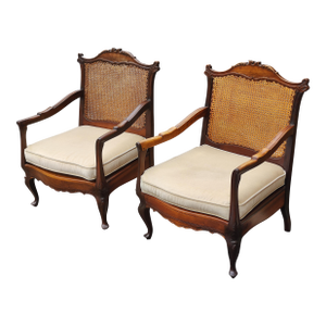 Early 19th Century Pair of Vintage French Walnut Foliage and Shell Arm Chairs With Hand-Woven Cane Seats