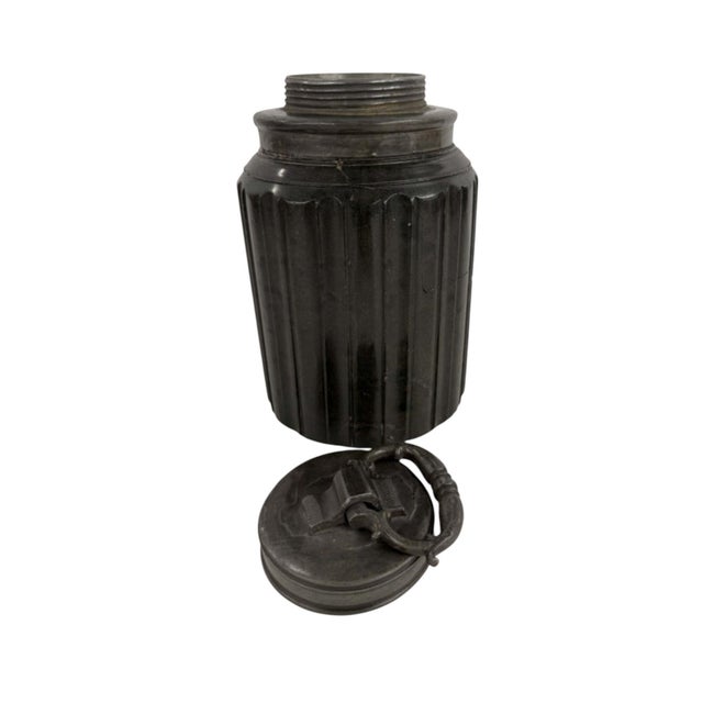 A dark green serpentine stone jar with pewter screw top cover.