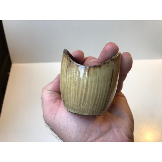 Small, unique and early pottery vase in earthy glazes by the danish ceramist Ady Krøyer. Made in her own studio during the...