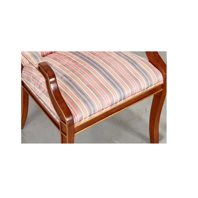 20th c., incl. (2) armchairs, (6) side chairs, parcel gilt mahogany frame with scrolling back rail, padded seat and back...