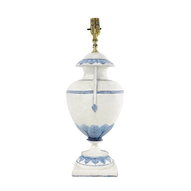 A pair of vintage blue and white metal trophy table lamps.