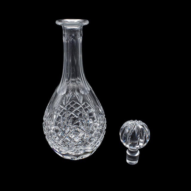 This is a vintage port decanter and glass duo. An Irish, crystal glass sherry or liqueur bottle with stem glass, dating to...
