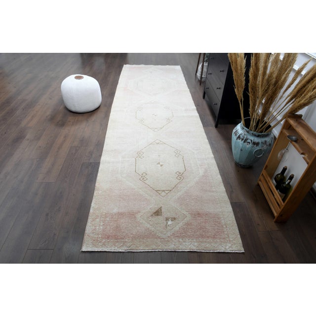 Vintage Hand-Knotted runner rug is a semi-antique vintage runner rug. The '70s Eastern region of Anatolian's unique rug is...
